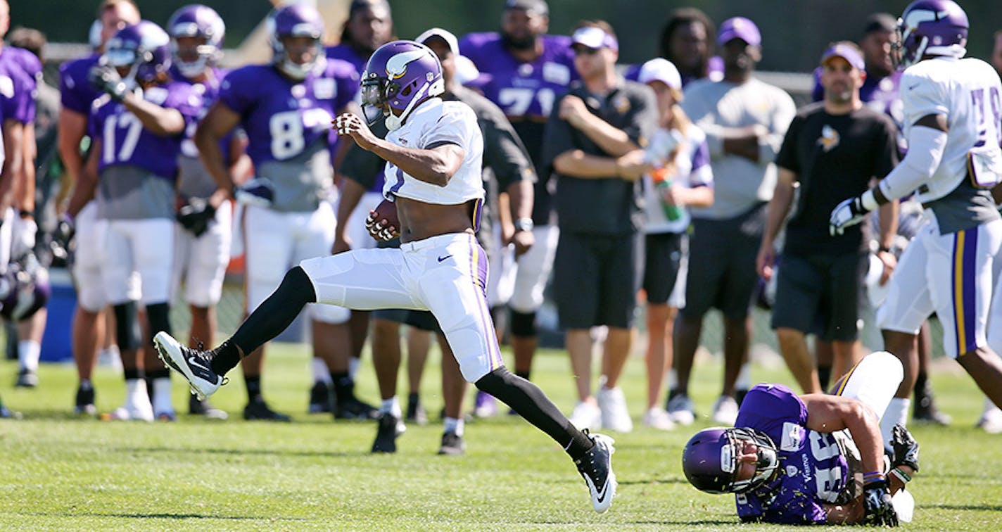 Cornerback Shaun Prater high stepped away from Chase Ford after intercepting a pass during Vikings training camp at Minnesota State University Mankato Wednesday July 29, 2015 in Mankato, MN.