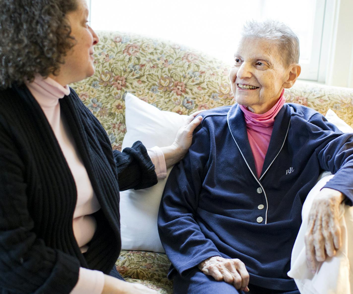 Sally Evans, left, speaks lovingly to her mother Wilma Evans at their condominium in St. Paul December 15, 2015. Wilma has dementia, and Sally and her siblings have been using the Healthsense eNeighbor system to monitor her movements. (Courtney Perry/Special to the Star Tribune)