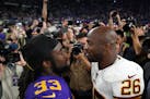 Vikings running back Dalvin Cook (33) talked with Redskins running back and former Vikings star Adrian Peterson (26) after the teams' Oct. 24 meeting.