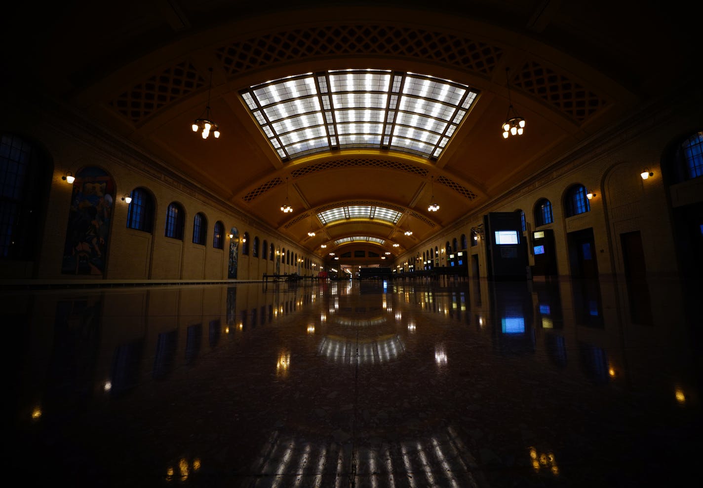 The Waiting Room inside Union Depot is 300 feet long and 70 feet wide with an acre (38,000 square feet) of decorative ceiling overhead. Sixty-three arched steel windows encircle the space for beautiful natural light in any season. Open daily until midnight, the Waiting Room was exceptionally quiet on this weekday evening. ] Shari L. Gross ¥ shari.gross@startribune.com Ramsey County spent $247 million buying and renovating the historic Union Depot in downtown St. Paul. The project was completed i