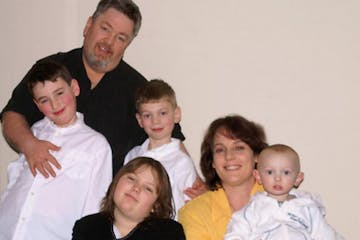 The McDonough family paid off $123,000 in debt and $25,000 in medical expenses in just 2.5 years. Here they are with their kids Robbie, 10, Maggie, 12