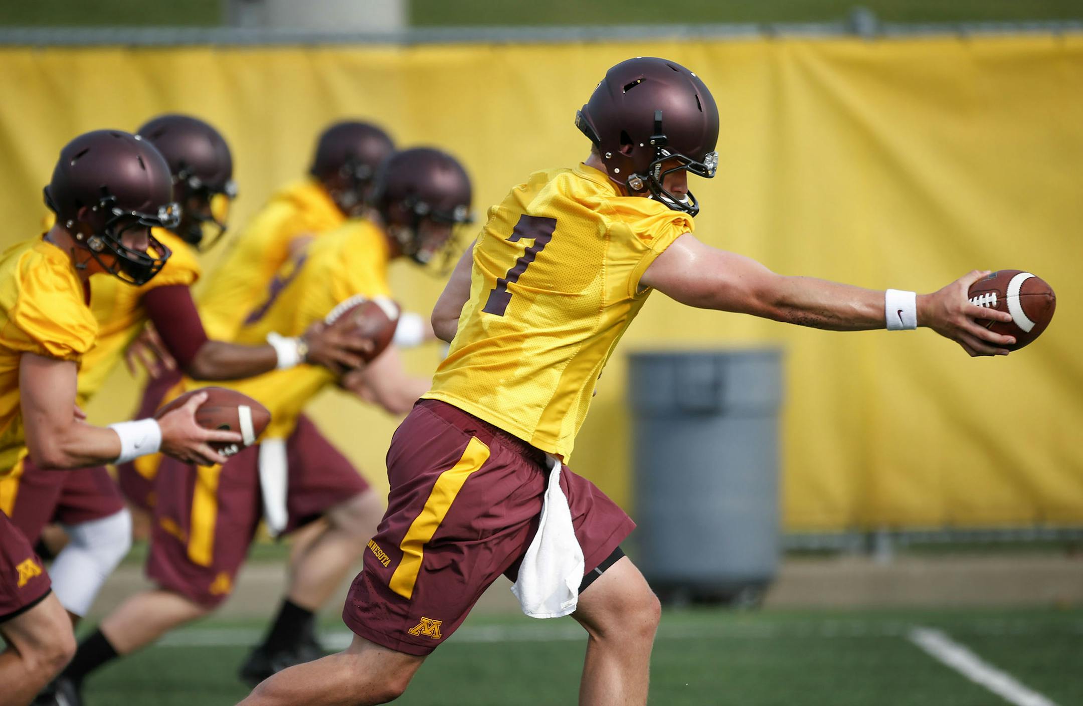 Practice began for the University of Minnesota football team and starting quarterback Mitch Leidner (7) worked on a handoff drill with fellow quarterbacks Friday, Aug. 1, 2014, at the Gibson-Nagurski complex on the University of Minnesota in Minneapolis MN.] (DAVID JOLES/STARTRIBUNE) djoles@startribune First day of practice for the University of Minnesota football team Friday, Aug. 1, 2014, at the Gibson-Nagurski complex on the University of Minnesota in Minneapolis MN.