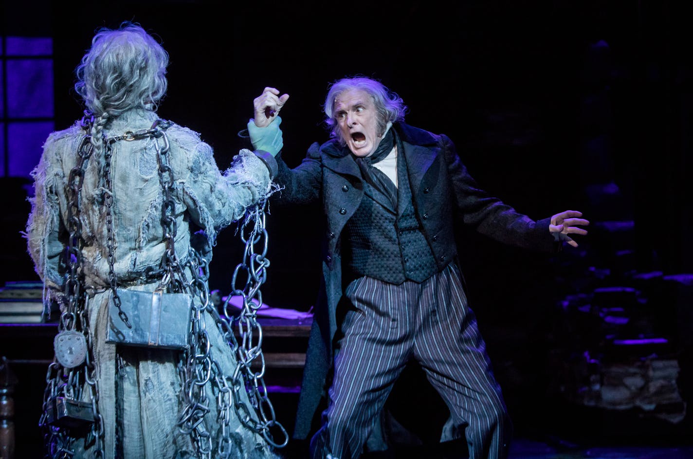 John Catron as Marley and Nathaniel Fuller as Scrooge in "A Christmas Carol" at the Guthrie Theater.