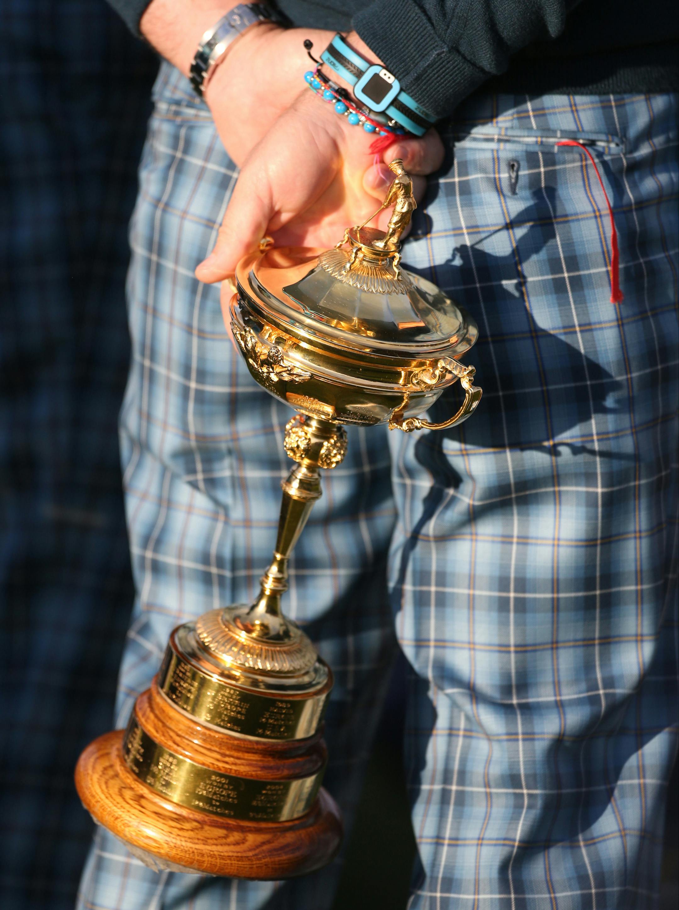 Europe team captain Paul McGinley holds the Ryder Cup trophy ahead of the Ryder Cup golf tournament at Gleneagles, Scotland, Tuesday, Sept. 23, 2014. (AP Photo/Peter Morrison)