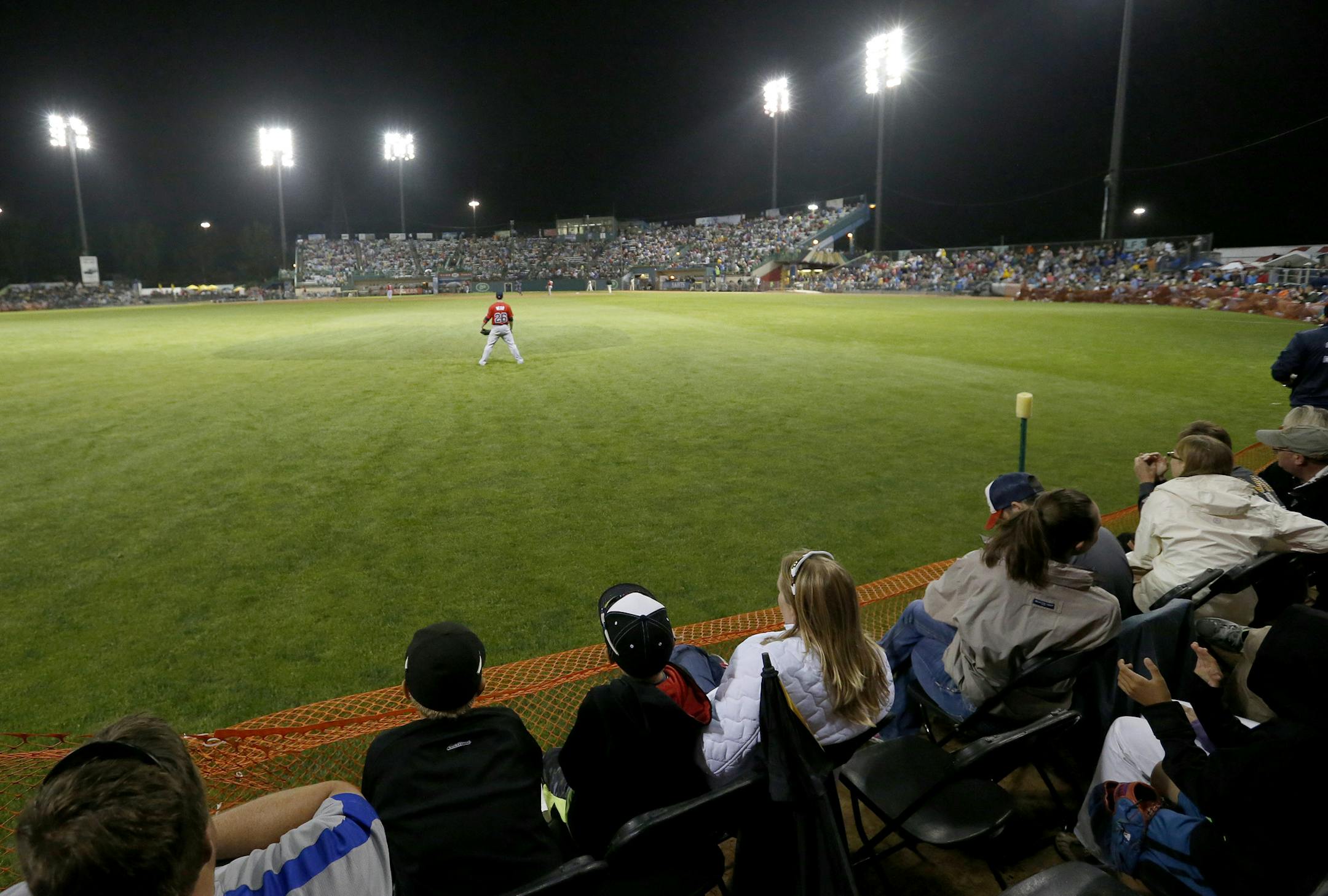 Fans watched the game from folding chairs placed on the warning track in the outfield during the St. Paul Saints final game at Midway Stadium on Thursday night. ] CARLOS GONZALEZ cgonzalez@startribune.com - August 28, 2014, St. Paul, Minn., Midway Stadium, St. Paul Saints baseball vs. Winnipeg - Final Saints game at Midway Stadium