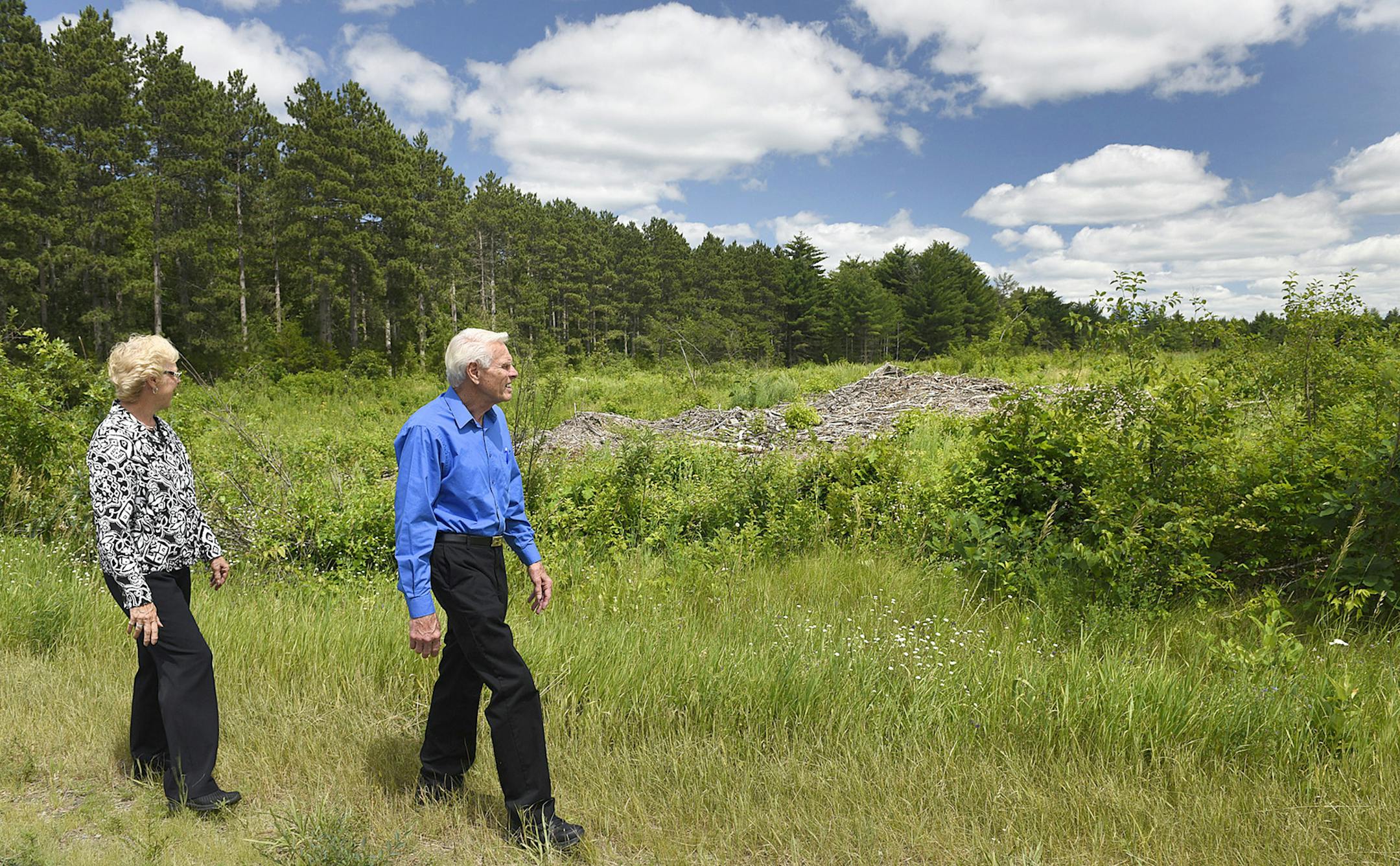 Ron and Judy Geurts look at what is left Tuesday of a clearcut area of trees in the Sand Dunes State Forest near their rural Big Lake home. The Department of Natural Resources plans to clearcut parts of the forest. ORG XMIT: MIN1507091830581100