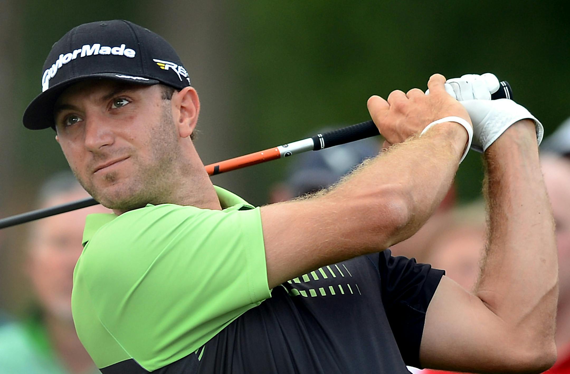 Dustin Johnson watches his drive from the 17th tee box during the first round of the Masters at Augusta National Golf Club in Augusta, Georgia, Thursday, April 11, 2013. (Jeff Siner/Charlotte Observer/MCT)