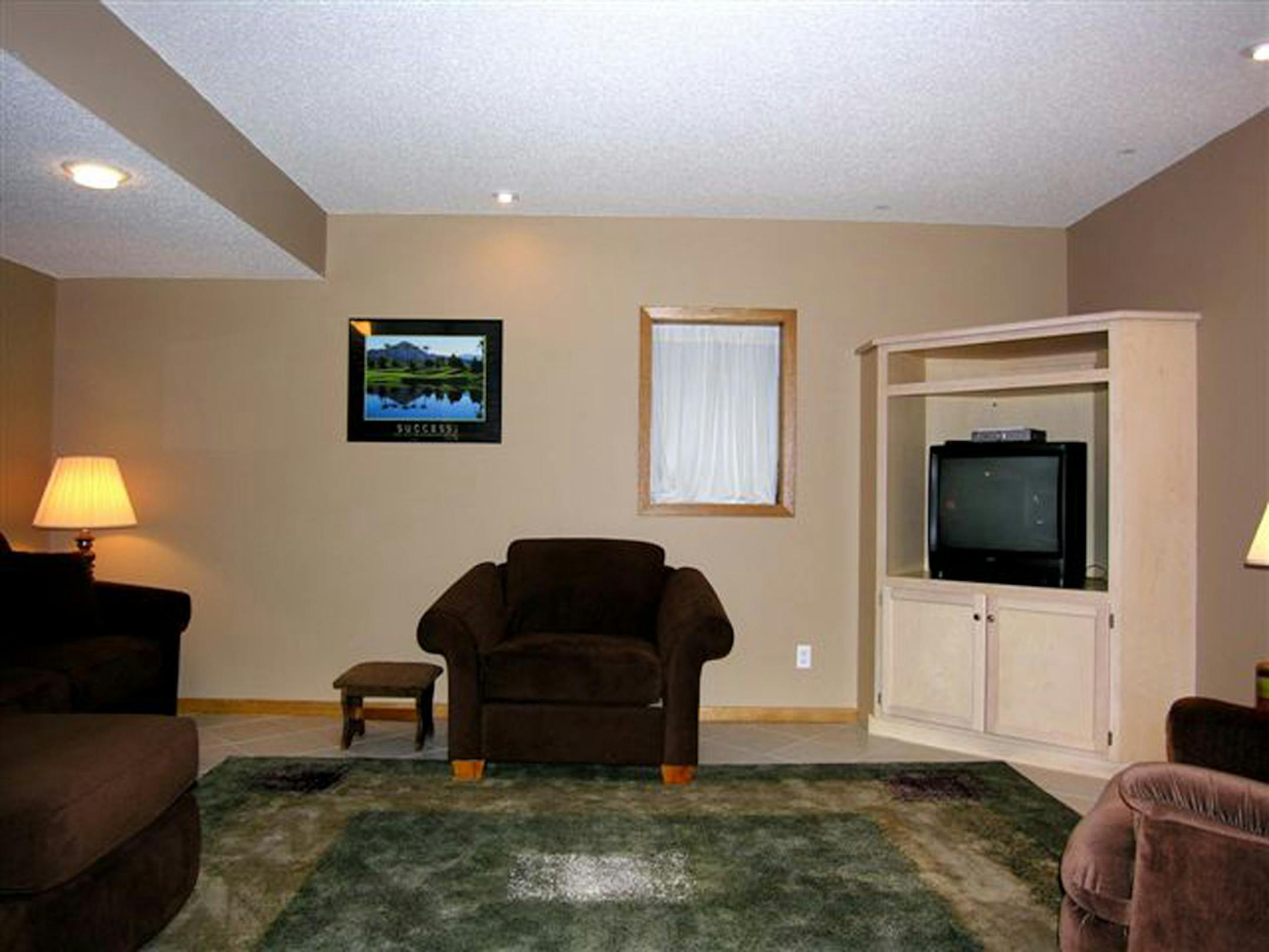 After: switching out the furniture from another room helped balance the color and flow in the room. Knick-knacks were removed, too.