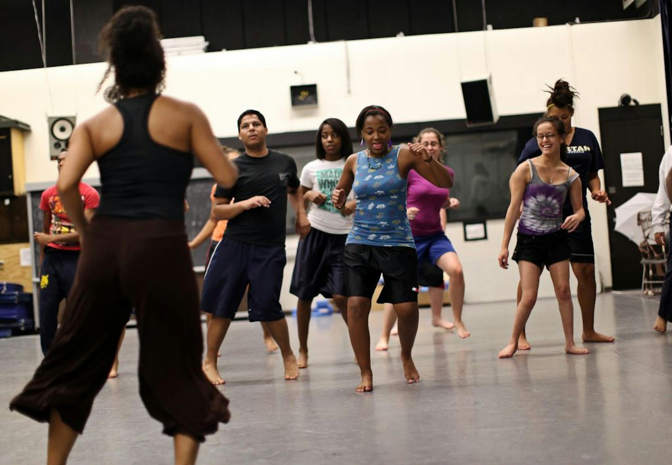 Students, including 17-year-old Denae Dutrieuille of St. Paul (center), danced in an African movement class as part of Penumbra Theatre's Summer Institute at the University of Minnesota.