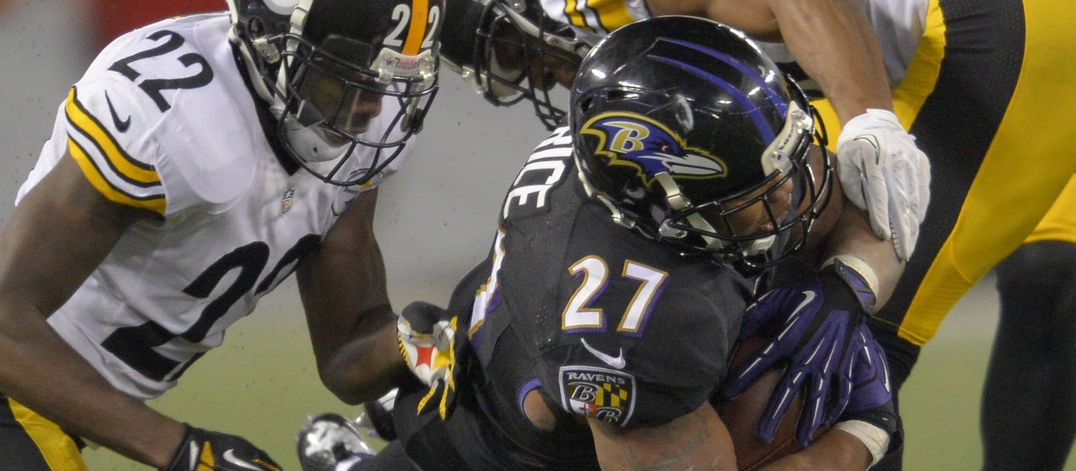 Baltimore Ravens running back Ray Rice dives between Pittsburgh Steelers cornerback William Gay and strong safety Will Allen for extra yards during the second half of a game won by the Ravens 22-20 in Baltimore on Thursday, November 28, 2013. (Doug Kapustin/MCT)