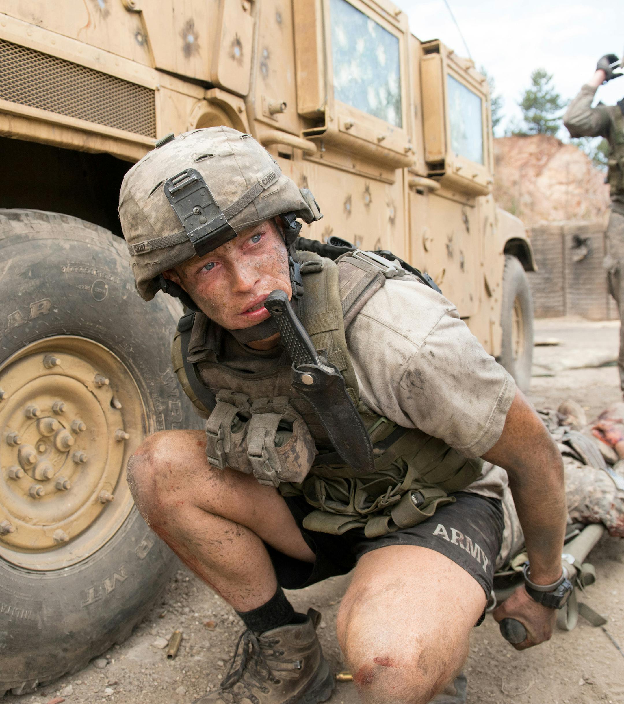 Caleb Landry Jones, left, in the movie "The Outpost." (Screen Media) ORG XMIT: 1705527
