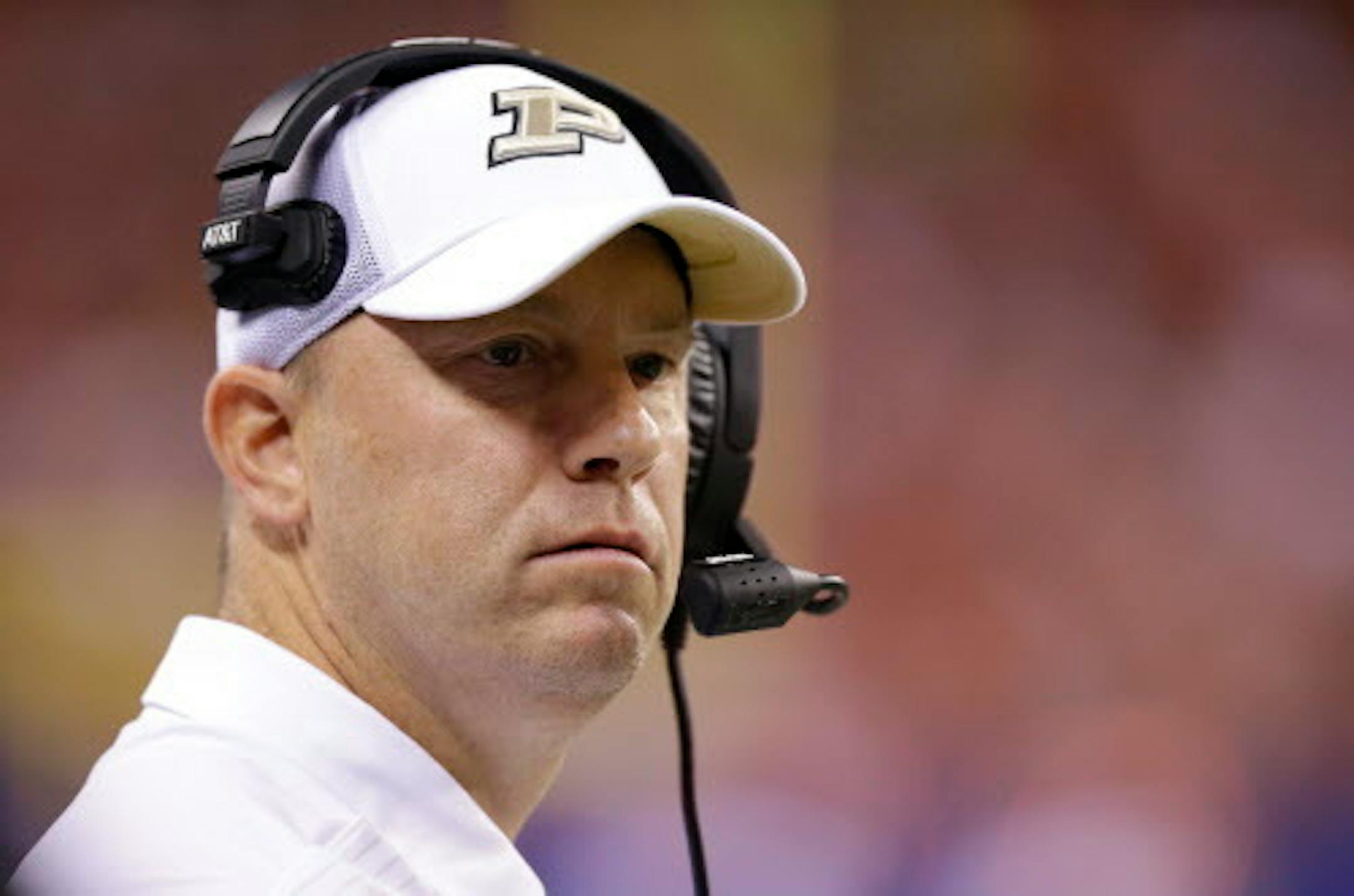 FILE - In this Saturday, Sept. 2, 2017 file photo, Purdue head coach Jeff Brohm yells from the sideline as his team played against Purdue during the first half of an NCAA college football game in Indianapolis. Since Jeff Brohm has come along and led the Boilermakers to a 2-1 start, back-to-back wins for the first time in five years and the biggest margin of victory in a road game since 1999, fans are guardedly optimistic he might be the guy to revive the school's football tradition. (AP Photo/Michael Conroy, File)