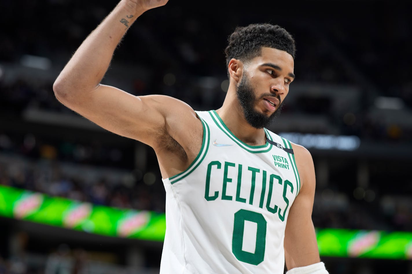 Boston Celtics forward Jayson Tatum gestures after scoring a basket against the Denver Nuggets in the second half of an NBA basketball game Sunday, March 20, 2022, in Denver. (AP Photo/)