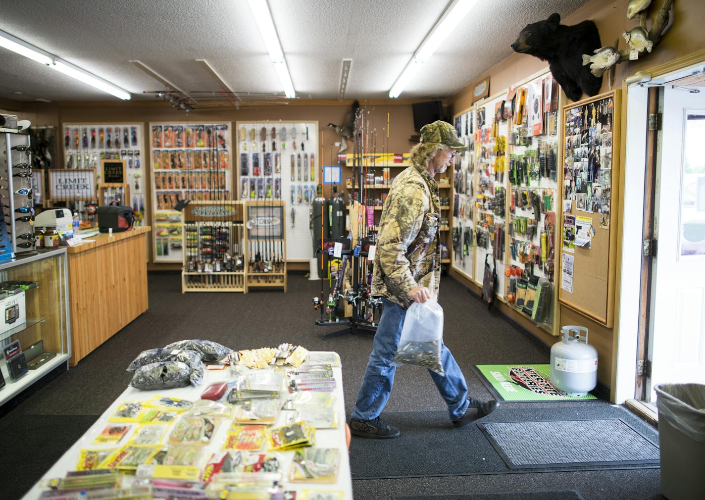 Christopher &#x201c;Red&#x201d; Rhodes of Forest Lake left Mike&#x2019;s Bait on 8 in Forest Lake with a bag full of minnows. Rhodes said Mike&#x2019;s Bait on 8, newly renovated by new owner Mike Traylor, is his favorite store.