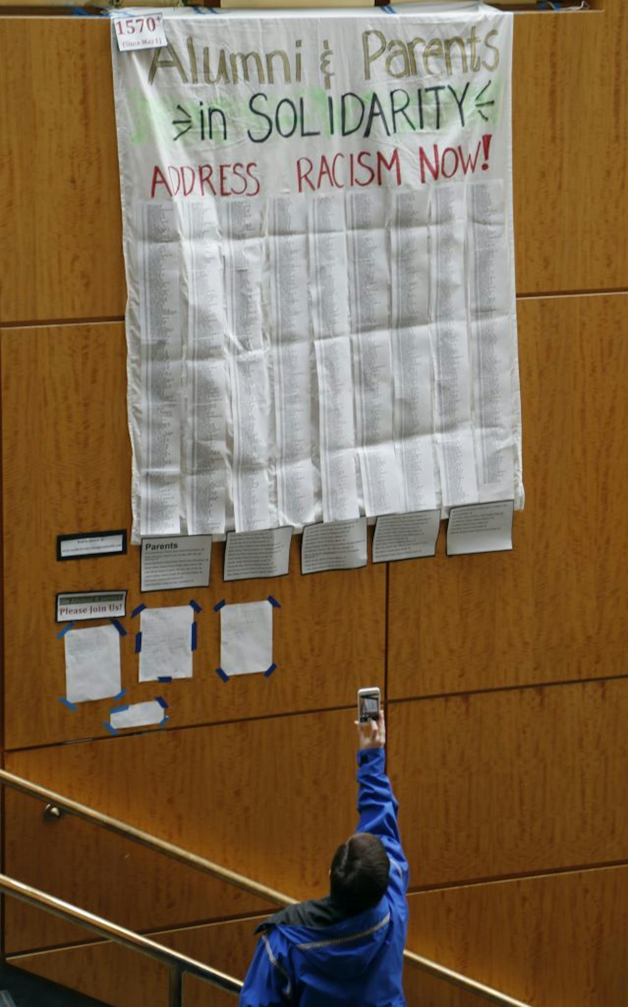 A student took a photograph of a banner that hung in Buntrock Commons at St. Olaf. The college released at statement Wednesday that the writing of a racist note and left on a black student's car April 29 was a hoax Wednesday May 10, 2017 in Northfield MN.