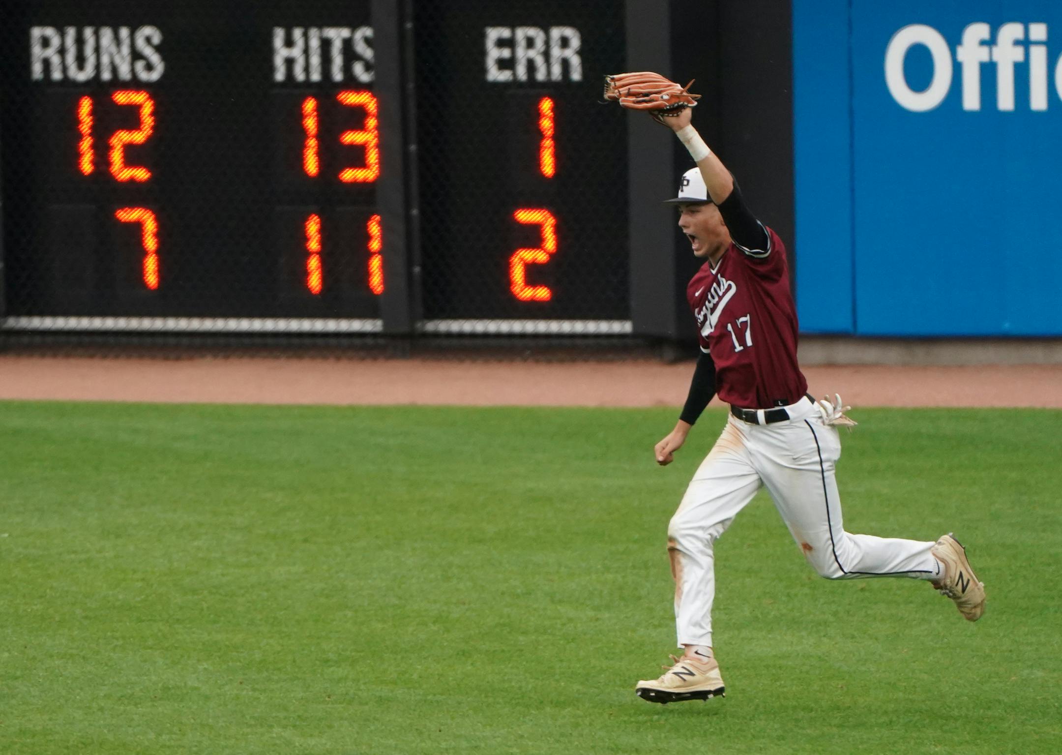 New Prague outfielder Cade Pavek (17) ran past the scoreboard and toward his teammates after catching the final out of a semifinal game against Rogers for a 12-7 victory. ] Shari L. Gross ¥ shari.gross@startribune.com New Prague defeated Rogers 12-7 in a state 4a semifinal baseball game at CHS Field in St. Paul, Minnesota on Saturday, June 15, 2019.