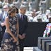 President Barack Obama and first lady Michelle Obama pay their respects during a memorial ceremony, Wednesday, April 9, 2014, at Fort Hood Texas, for 