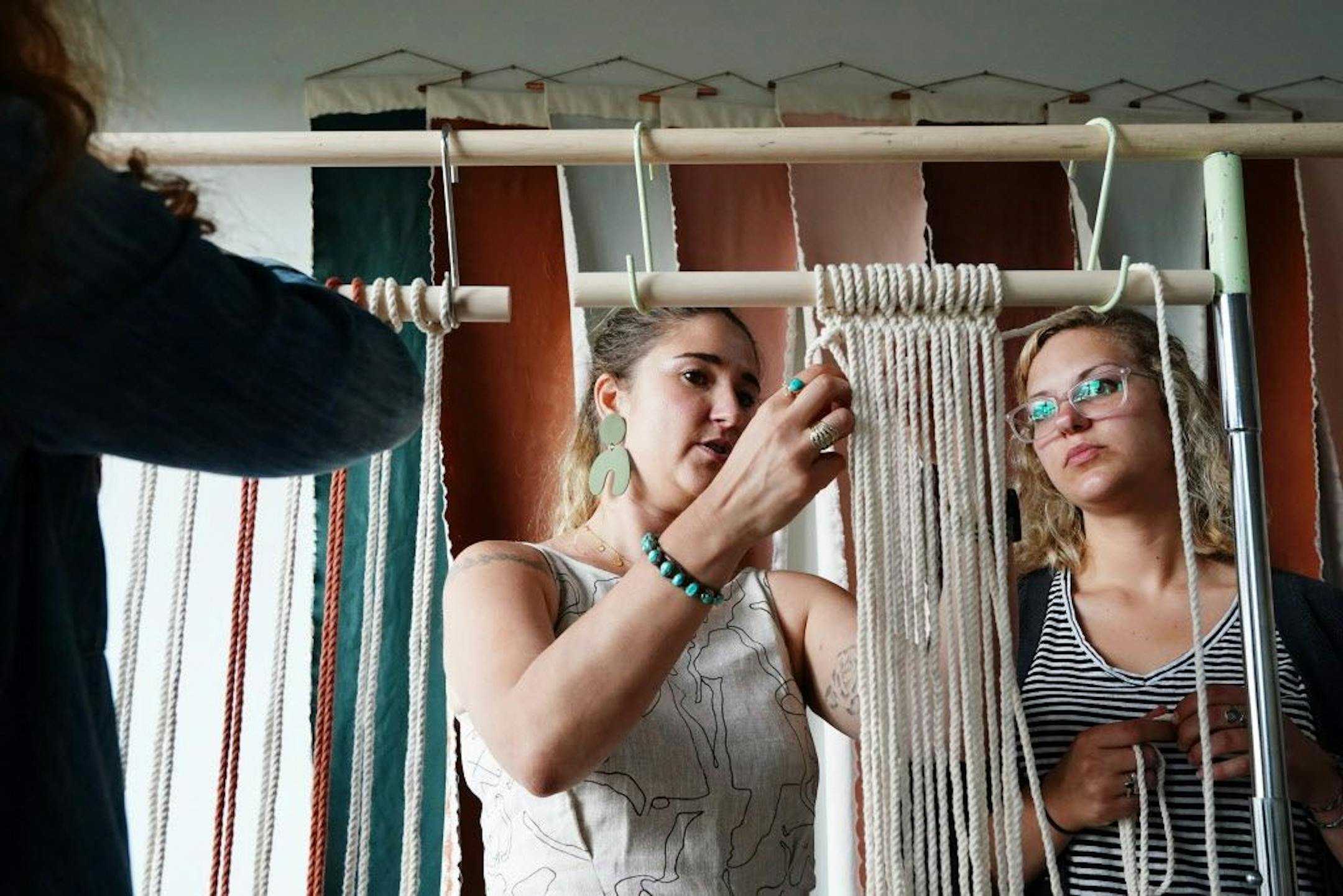 Emily Katz helped Danielle Massa with her macrame projects during the class.