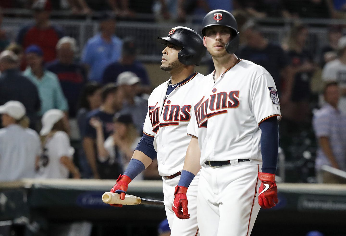 Minnesota Twins designated hitter Nelson Cruz (23), left, and Minnesota Twins catcher Mitch Garver (18) walk off the field after losing. ] LEILA NAVIDI &#x2022; leila.navidi@startribune.com BACKGROUND INFORMATION: The Minnesota Twins play against the New York Mets at Target Field in Minneapolis on Tuesday, July 16, 2019. The New York Mets won 3-2.