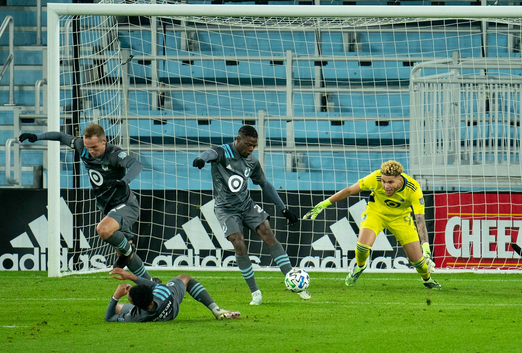 Minnesota United defender Bakaye Dibassy (21) cleared a loose ball in front of Minnesota United goalkeeper Dayne St. Clair (97) in the second half.