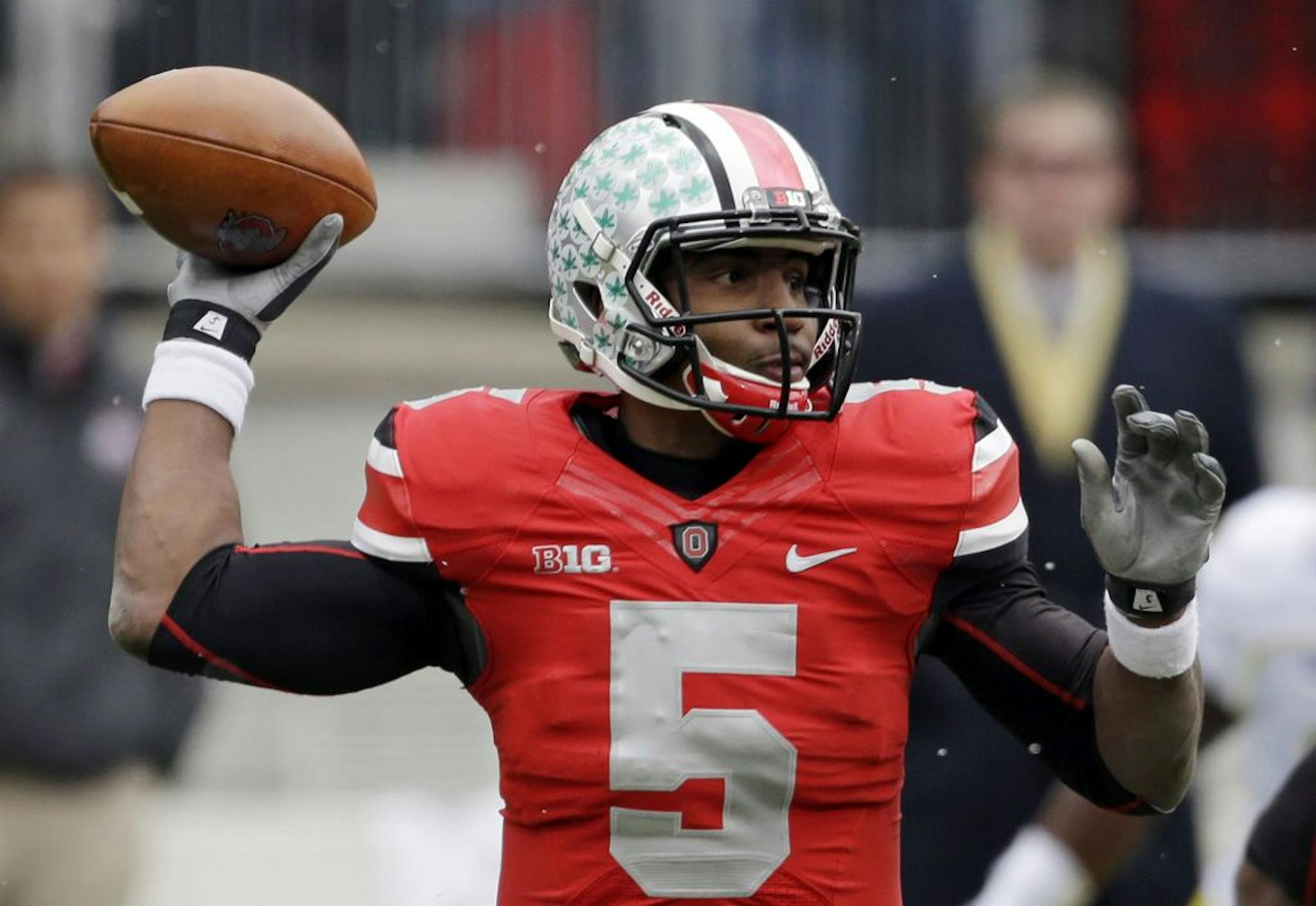 Ohio State quarterback Braxton Miller passes against Michigan in the first quarter of an NCAA college football game, Saturday, Nov. 24, 2012, in Columbus, Ohio.