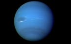 This August 1989 image provided by NASA shows the planet Neptune photographed by the Voyager 2 spacecraft, processed to enhance the visibility of smal