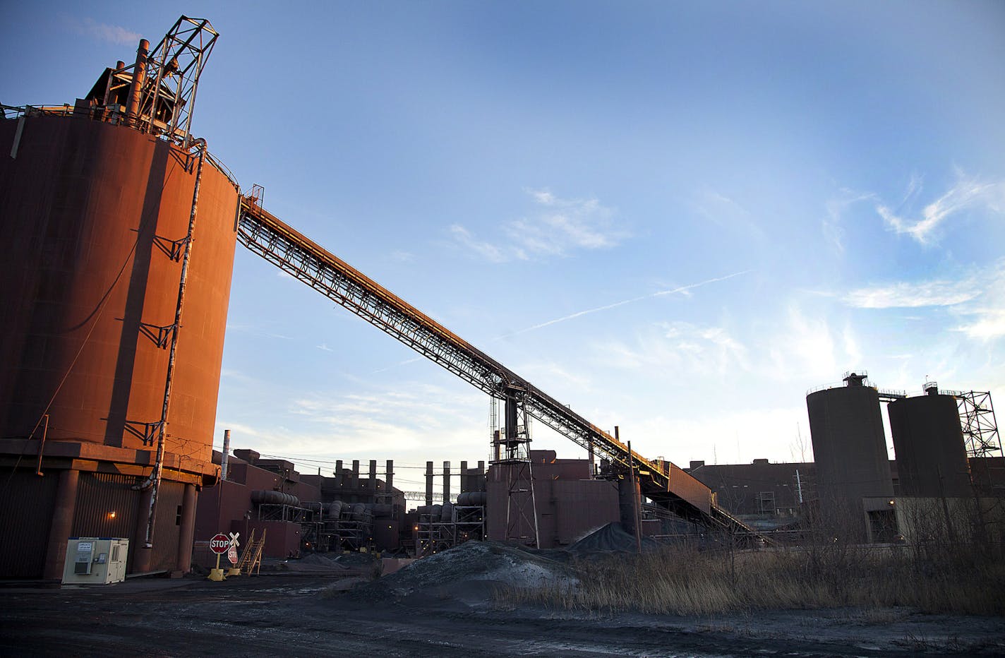 Pellet load-out bins stand at the back of the Hibbing Taconite Co. pellet manufacturing plant in this file photo. (ARIANA LINDQUIST/Bloomberg)