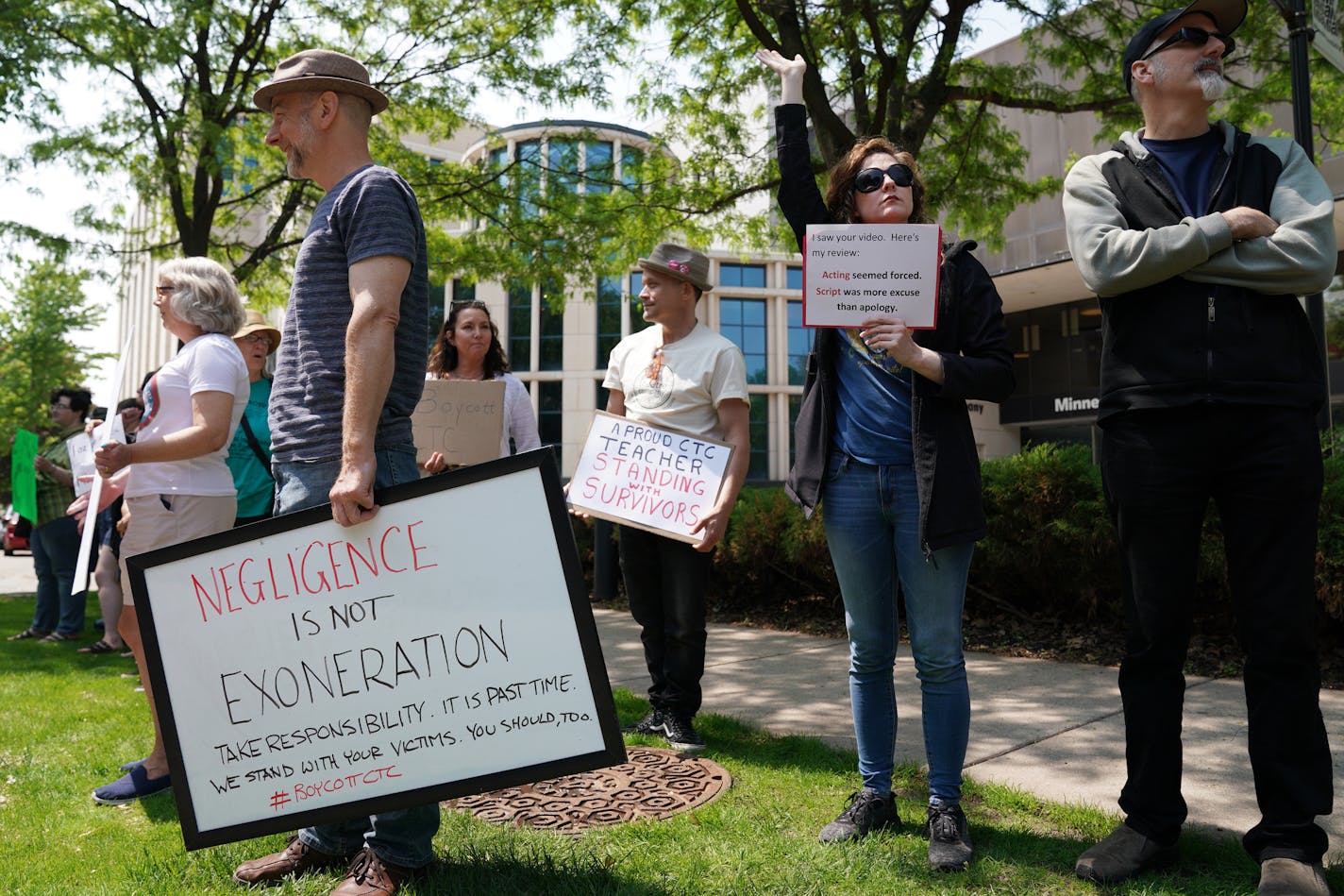 Heidi Fellner of Minneapolis, right, waved to passing cars as she stood with fellow protesters outside the theater last month organized by survivors of sexual assaulted by Children's Theatre instructors. Laura Stearns and Erin Nanasi, two women who reported being sexually assaulted by Children's Theatre instructors in the 1980s, led a protest outside the theater Saturday, June 1, 2019 ahead of the 2 p.m. showing of "Matilda" in south Minneapolis.