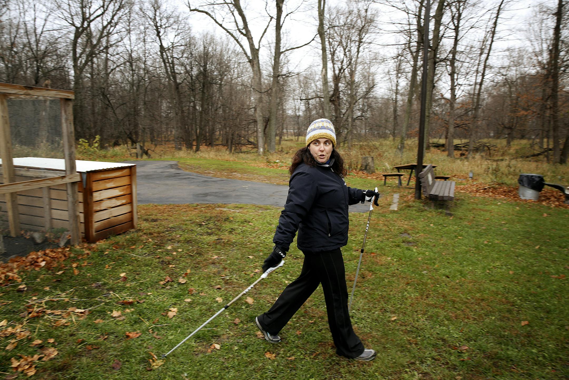 Sherry Taplin, an Anoka County naturalist who teaches a class in nordic walking, demonstrates the style of fitness walking that includes poles at Wargo Nature Center in Lino Lakes. ] LEILA NAVIDI leila.navidi@startribune.com / BACKGROUND INFORMATION: Wednesday, November 5, 2014. Cross country skiers invented it a few decades ago to keep in shape during the off season. Nordic walking is now becoming the rage in Twin Cities parks.