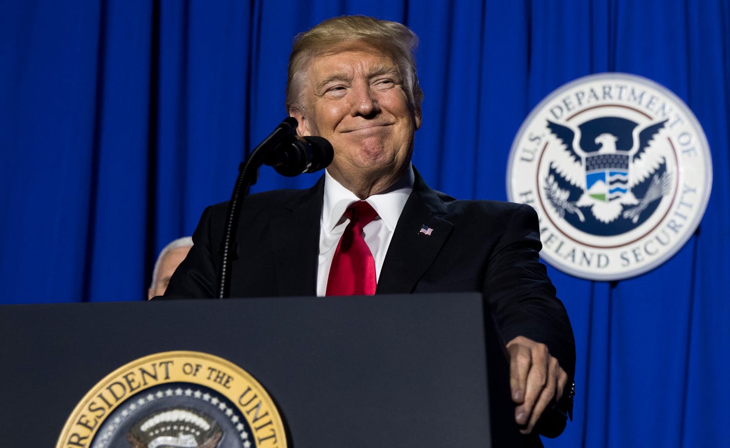 FILE-- President Donald Trump speaks after signing an executive action that will order the construction of a Mexican border wall, at the Department of Homeland Security in Washington, Jan. 25, 2017. When Trump addressed employees of the department, just five days after being sworn in, he essentially had one issue on his mind: cracking down on illegal immigration. The president, critics say, has pushed a single-minded focus on a sprawling department whose duties include airline safety, disaster r