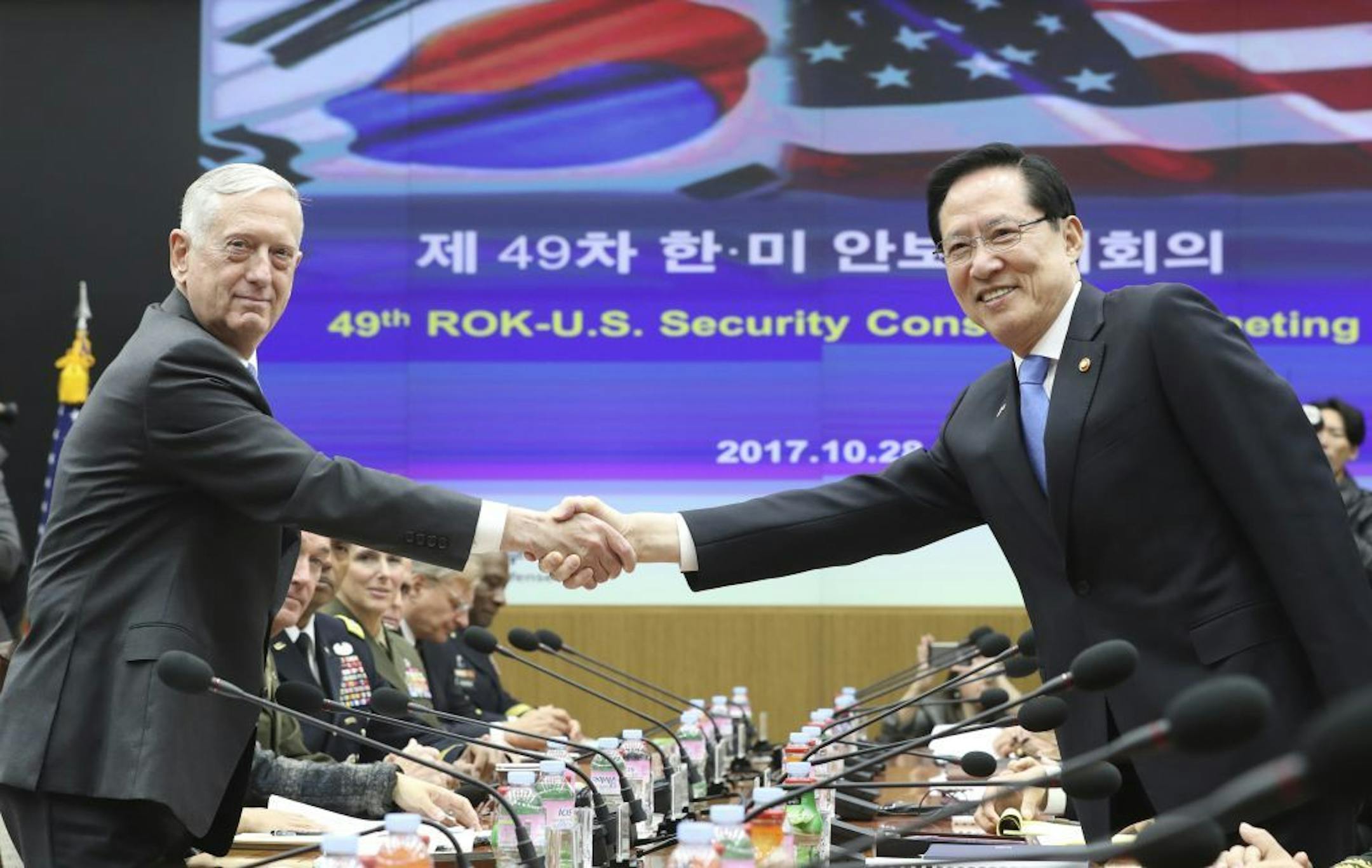 U.S. Defense Secretary Jim Mattis, left, and South Korean Defense Minister Song Young-moo shake hands while posing for a photo prior to the 49th Security Consultative Meeting (SCM) at Defense Ministry in Seoul, South Korea, Saturday, Oct. 28, 2017.