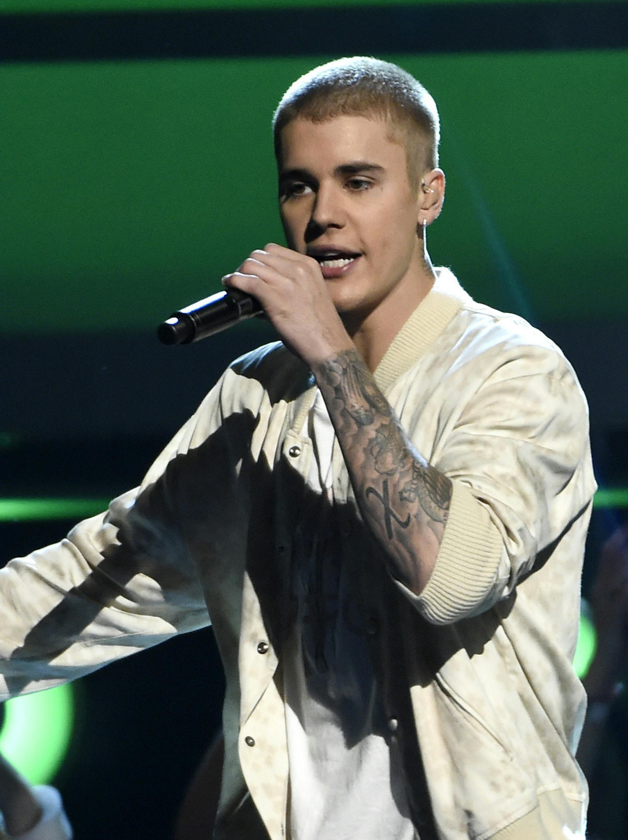 FILE - In this May 22, 2016 file photo, Justin Bieber performs at the Billboard Music Awards in Las Vegas. Bieber scored four Grammy nominations with his redemption album ìPurposeî nominated for album of the year, announced Tuesday, Dec. 6. (Photo by Chris Pizzello/Invision/AP, File)