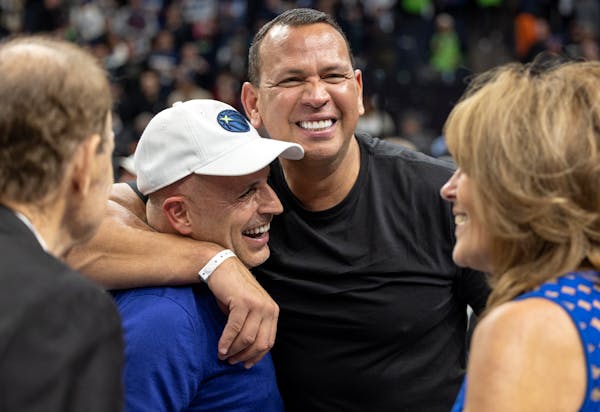 Marc Lore, Alex Rodriguez, Glen and Becky Taylor celebrate at the end of a Timberwolves game in April.