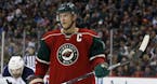 Minnesota Wild center Mikko Koivu (9), of Finland, gets into position for a face-off during the second period of an NHL hockey game against the Winnip