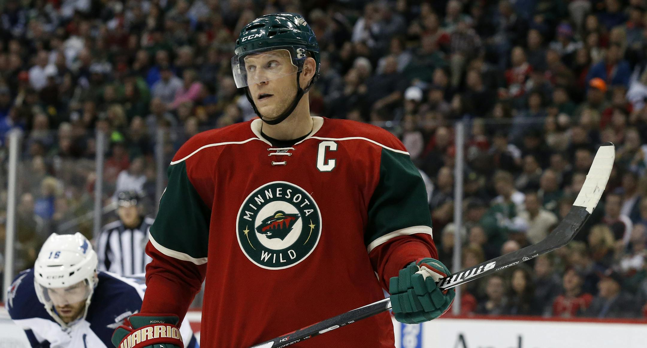 Minnesota Wild center Mikko Koivu (9), of Finland, gets into position for a face-off during the second period of an NHL hockey game against the Winnipeg Jets in St. Paul, Minn., Tuesday, Nov. 10, 2015. (AP Photo/Ann Heisenfelt) ORG XMIT: MIN2015111619512777