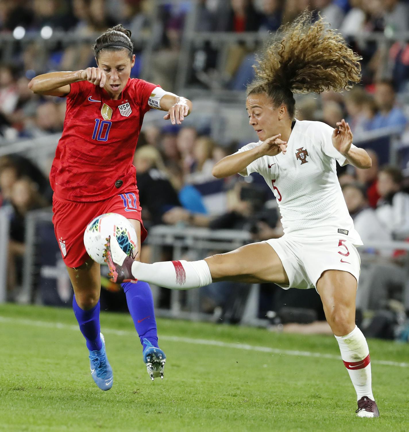 USA forward Carli Lloyd (10), left, and Portugal defender Matilde Fidalgo (5) battled during the second half. ] LEILA NAVIDI &#x2022; leila.navidi@startribune.com BACKGROUND INFORMATION: Exhibition soccer match between the USA and Portugal at Allianz Field in St. Paul on Tuesday, September 3, 2019. USA won the game 3-0.