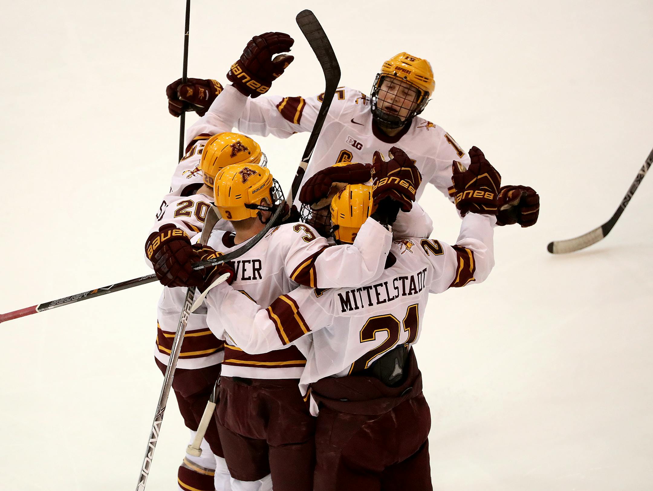 Gophers players celebrated a goal by Jack Glover against Ohio State in the second period Friday
