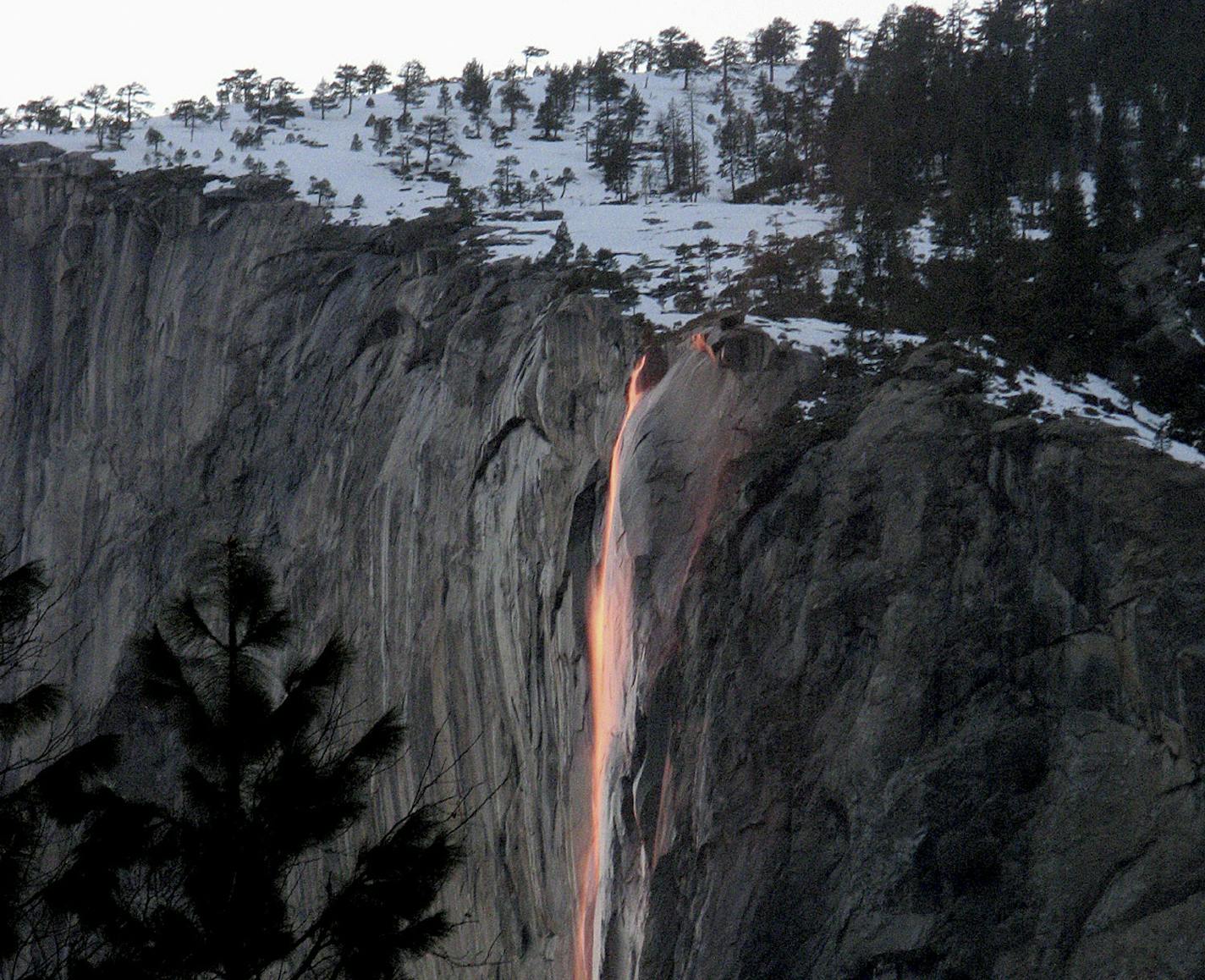 In this February 2008 photo provided by Scott Gediman of the Yosemite National Park Service, the setting sun hits Horsetail Fall at just the right angle to light it up as if it's on fire, in Yosemite Calif. This natural phenomena occurs for just two weeks in February and is reminiscent of the old firefall of burning embers that park employees pushed over Glacier Point to entertain guests until 1968. (AP Photo/Yosemite National Park Service, Bethany Gediman) MANDATORY CREDIT