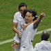 United States' Jermaine Jones, center, celebrates scoring his side's first goal during the group G World Cup soccer match between the USA and Portugal