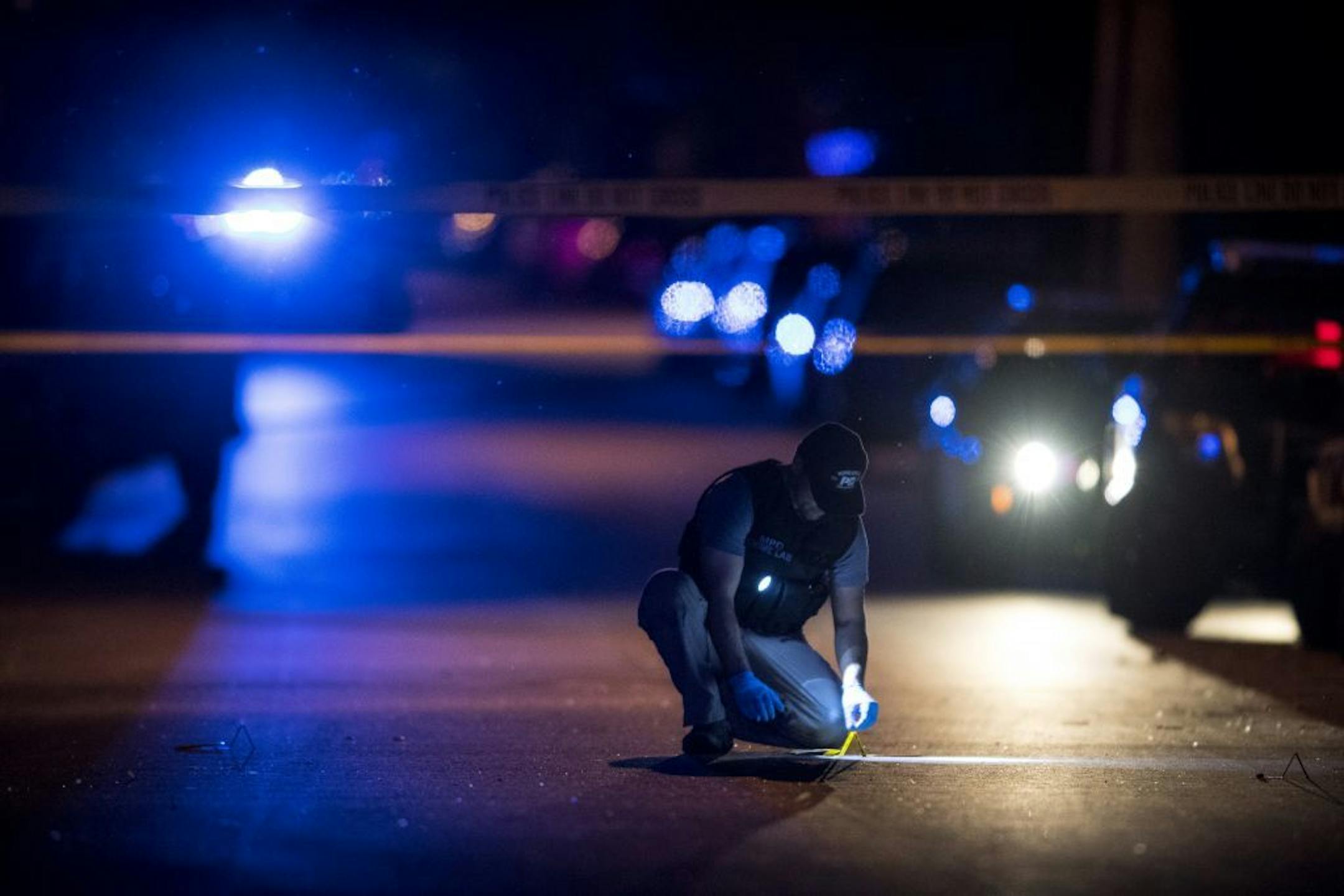 A Minneapolis Police Crime Lab investigator worked the scene of a shooting on Logan Avenue between north 35th and 36th avenues late Thursday night in Minneapolis.