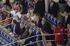 President Donald Trump, center seated, talks with other Republican lawmakers during Game 5 of baseball World Series between the Houston Astros and Was