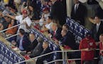 President Donald Trump, center seated, talks with other Republican lawmakers during Game 5 of baseball World Series between the Houston Astros and Was