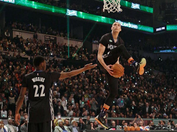 Zach LaVine, right, got assistance from fellow Wolves rookie Andrew Wiggins during the All-Star Game slam dunk competition last year.