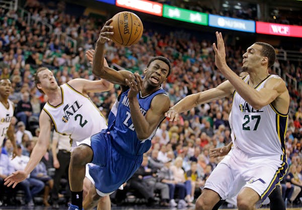 Timberwolves forward Andrew Wiggins drove between the Jazz's Joe Ingles (2) and Rudy Gobert (27) in the second quarter Monday in Salt Lake City.
