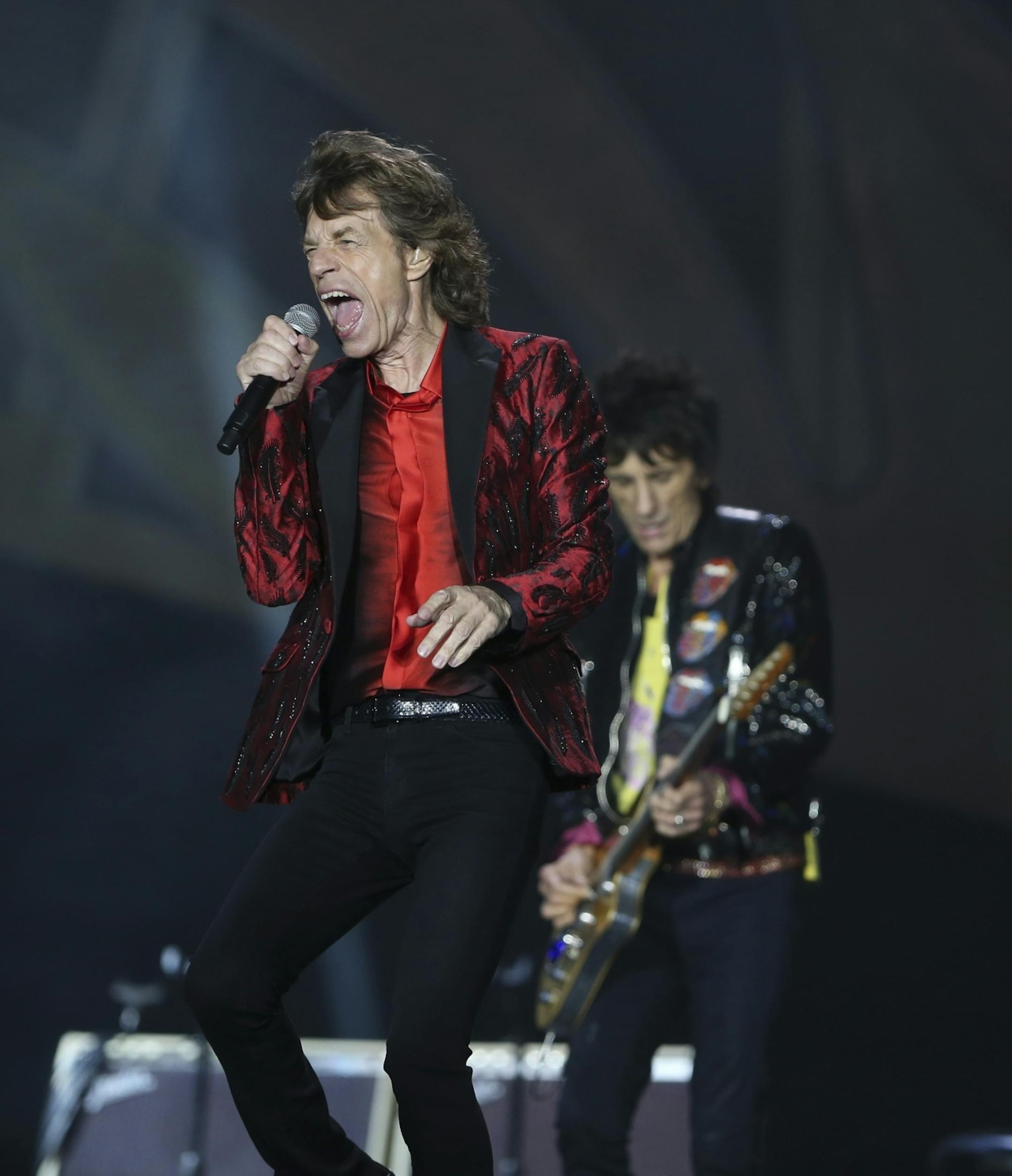 Mick Jagger of the Rolling Stones, foreground, with guitarist Ron Wood, rear, at TCF Bank Stadium Wednesday night.