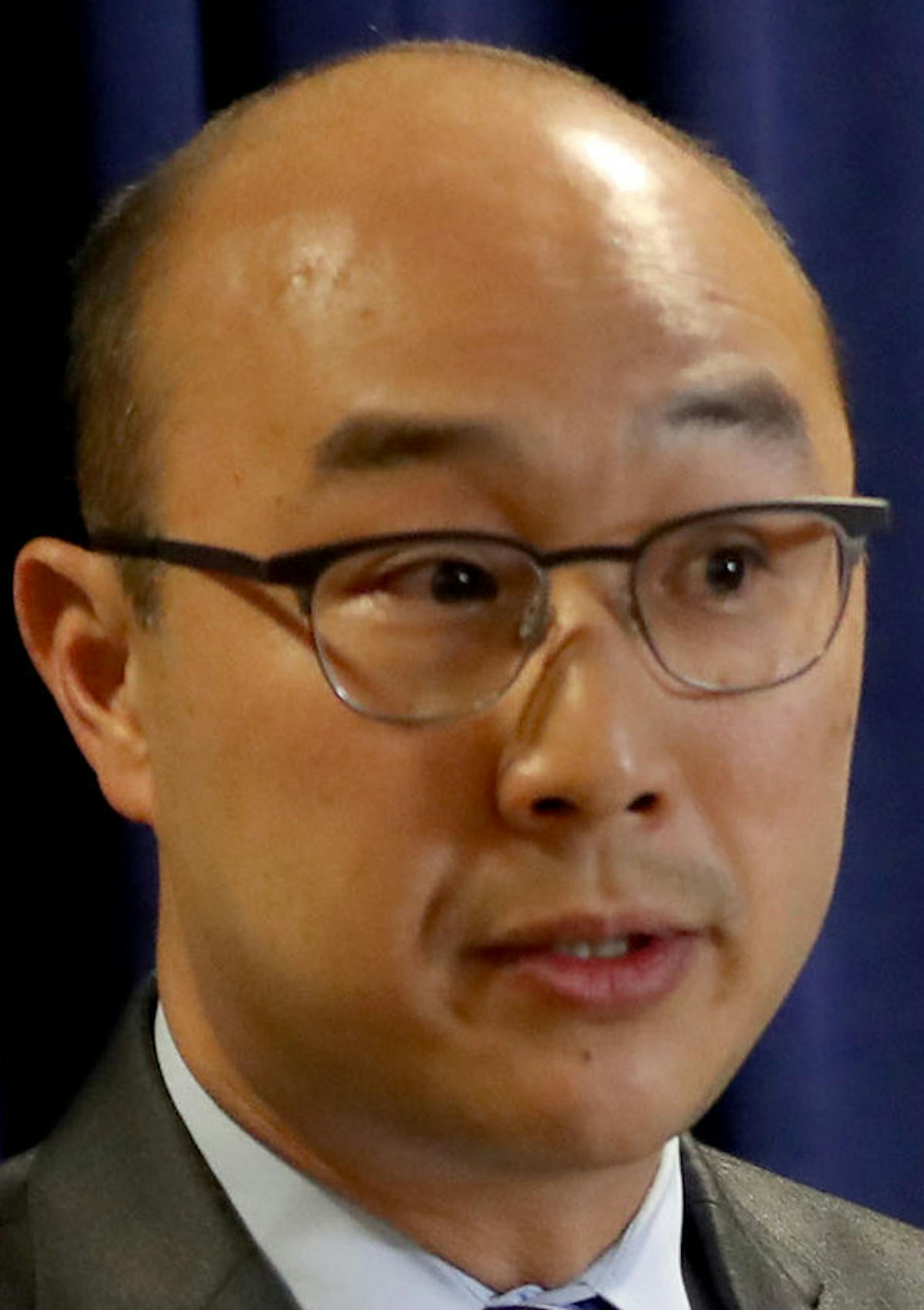 Ramsey County Attorney John Choi speaks at a press conference at his office Wednesday, July 20, 2016, with Paul Iovino of the St. Paul Police Department in St. Paul, Minn. The Archdiocese of St. Paul and Minneapolis publicly admitted wrongdoing Wednesday for the way it handled sexual abuse allegations against a former priest, while prosecutors dropped criminal charges that alleged the archdiocese turned a blind eye to his repeated misconduct. (David Joles/Star Tribune via AP)