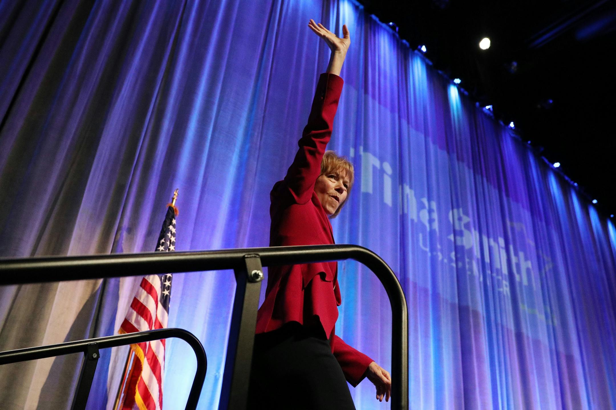 U.S. Sen. Tina Smith waved as she took the stage during the DFL State Convention Friday.