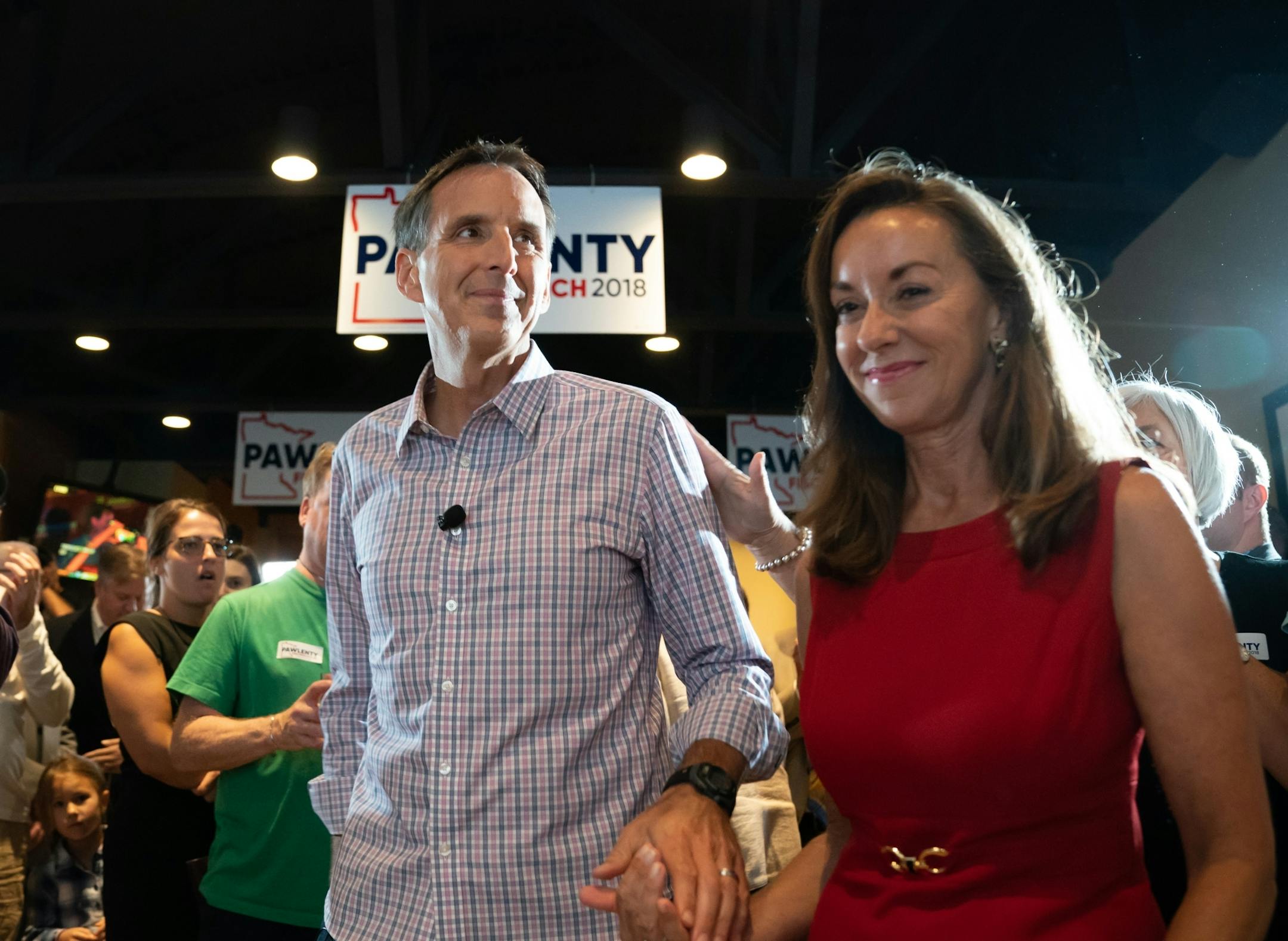 Tim Pawlenty stood with his wife Mary and running mate Michelle Fischbach as he conceded his run for governor at his election night gathering at Granite City Food and Brewery in Eagan.