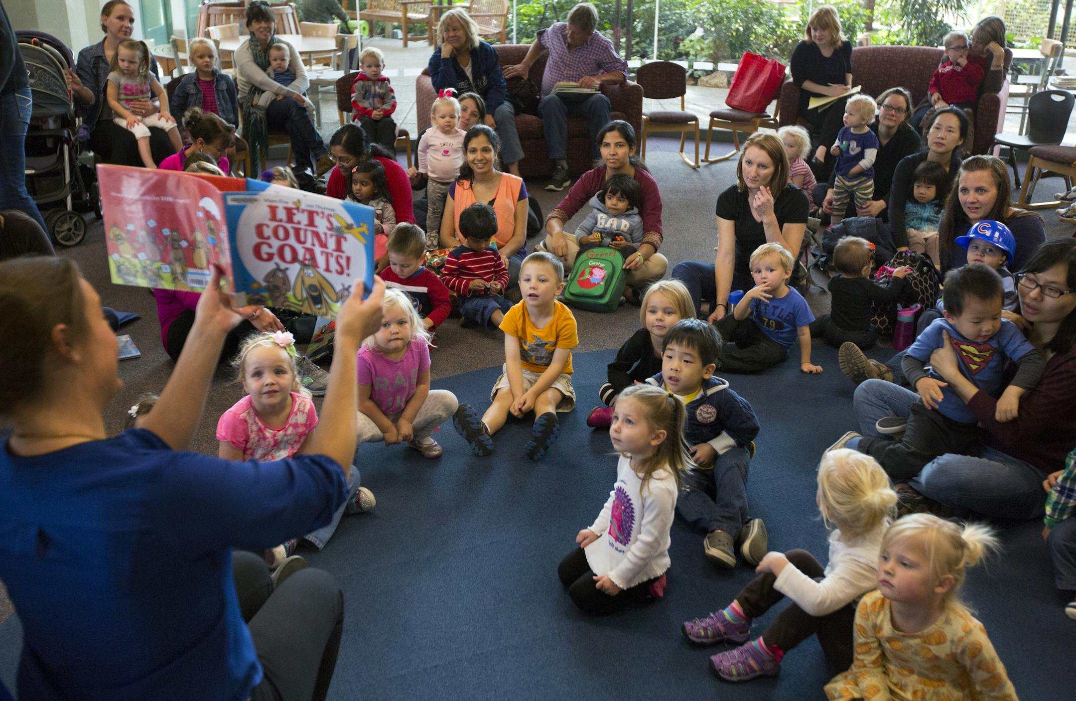 Story time is increasingly popular at Washington County libraries. Here, Dawn LaBrosse reads a book during Toddler Story Time at the RH Stafford Library in Woodbury. ] Brian.Peterson@startribune.com Woodbury, MN - 10/14/2015
