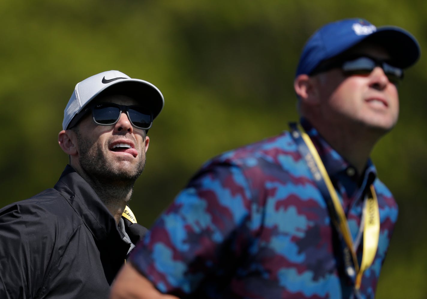 Former New York Mets baseball player David Wright, left, watches a shot by Brooks Keopka during the first round of the PGA Championship golf tournament, Thursday, May 16, 2019, at Bethpage Black in Farmingdale, N.Y. (AP Photo/Julio Cortez)